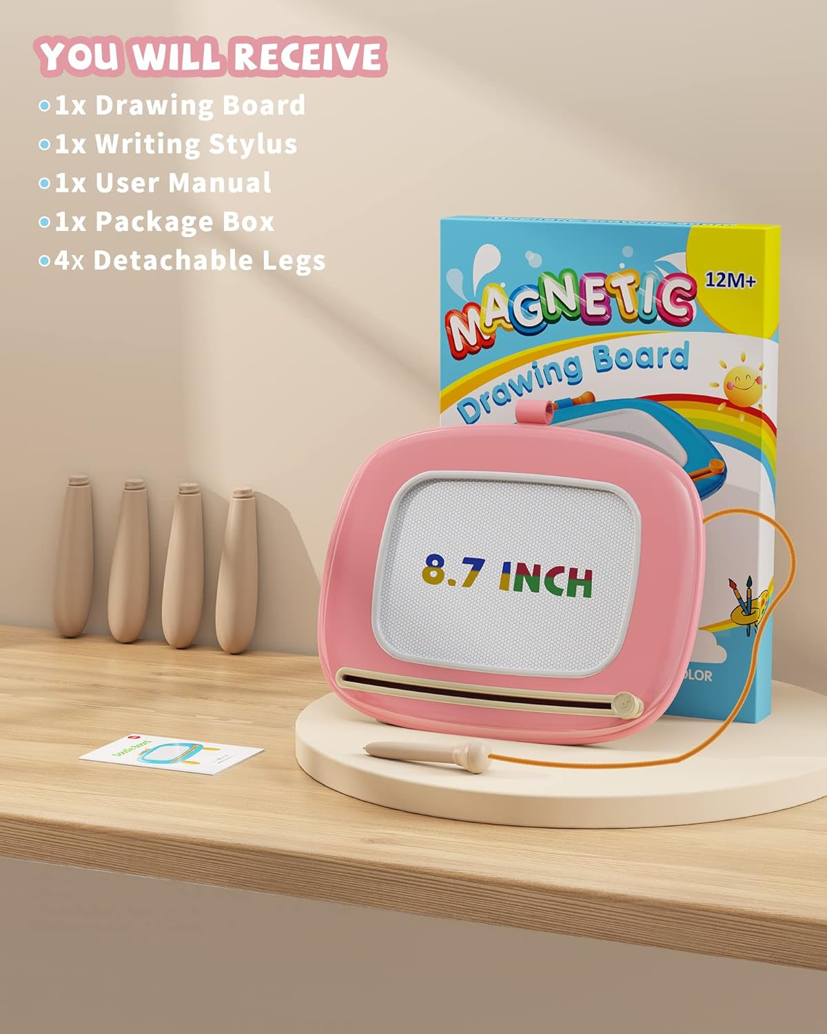 Kikapabi Magnetic Drawing Board set includes a pink 8.7-inch drawing board, writing stylus, user manual, package box, and four detachable legs. Perfect for creative play and learning.