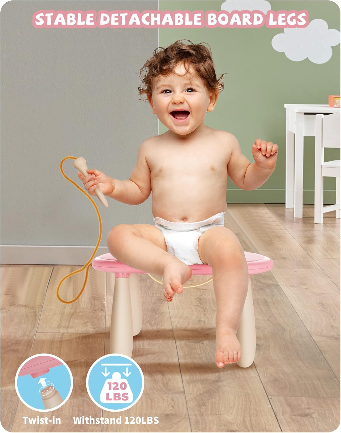 A happy toddler sitting on the stable detachable legs of the Kikapabi Magnetic Drawing Board. The image highlights the twist-in feature and the board’s ability to withstand up to 120 pounds, ensuring safe and enjoyable playtime.