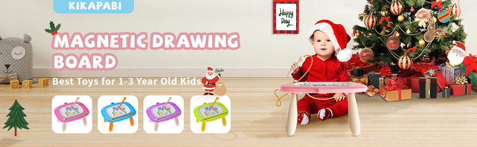 Kikapabi Magnetic Drawing Board – Best Toys for 1-3 Year Old Kids. A toddler enjoying creative play with the pink drawing board near a festive Christmas tree.