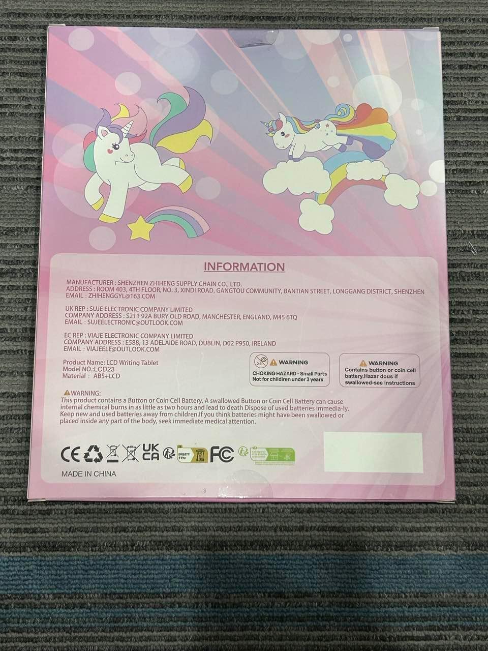 Back of the Kikapabi Unicorn LCD Writing Tablet packaging, featuring product details, manufacturer information, and safety warnings.